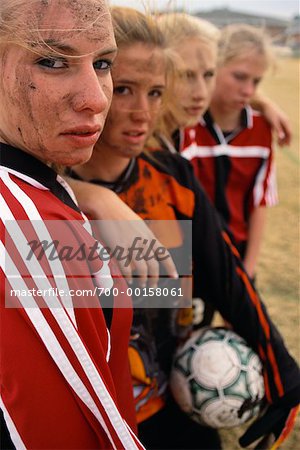 Portrait of Muddy Female Soccer Players