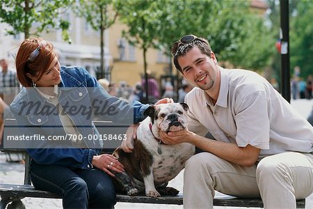 Couple and Dog on Bench