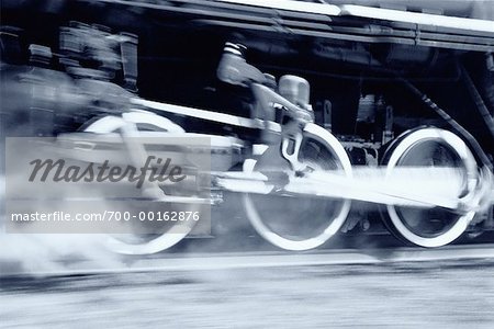 Close-Up of Wheels of Locomotive in Motion