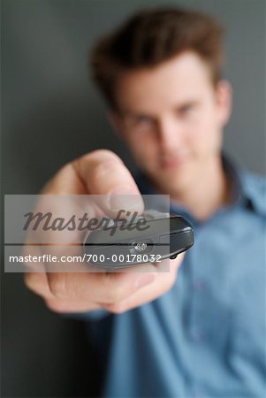 Man Holding Remote Control