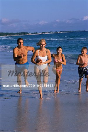 Family Running on Beach