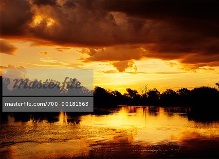 Clouds and Sunset Over Lake