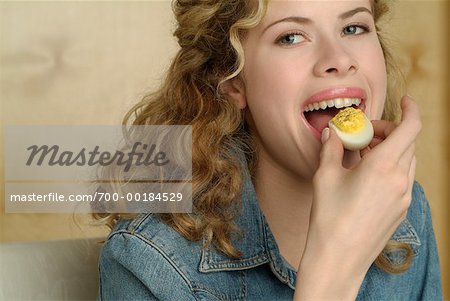 Woman Eating Eggs