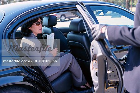 Businesswoman Getting Out of Car