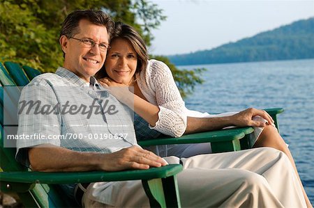 Couple in Deck Chairs by Water