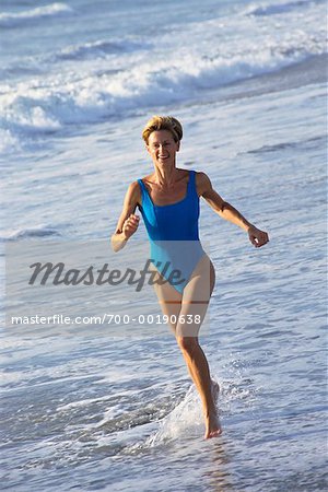 Woman Running on Beach