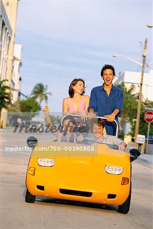 Two Couples in Small Convertible