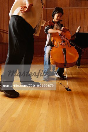 Student Playing Cello for Teacher