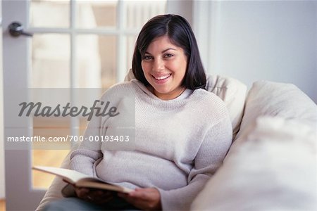 Woman Reading on Sofa