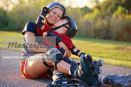 Mother Teaching Son to In-Line Skate