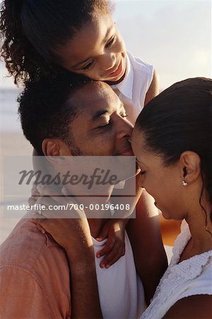 Couple with Child on Beach