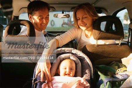 Couple with Baby in Vehicle