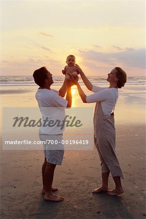 Couple With Baby On Beach Stock Photo Masterfile Rights Managed Artist Kevin Radford Code 700