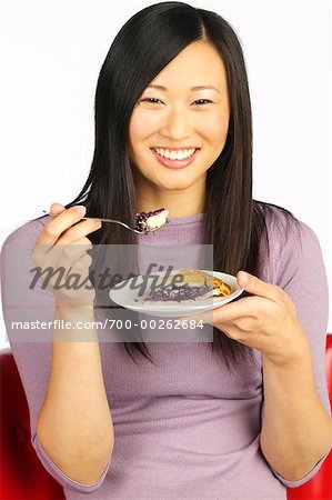 Woman Holding Plate of Food