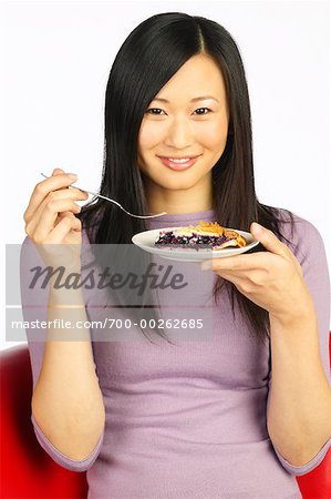 Woman Holding Plate of Food