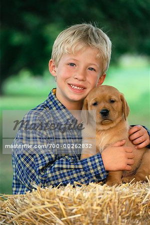 Portrait of Boy with Puppy