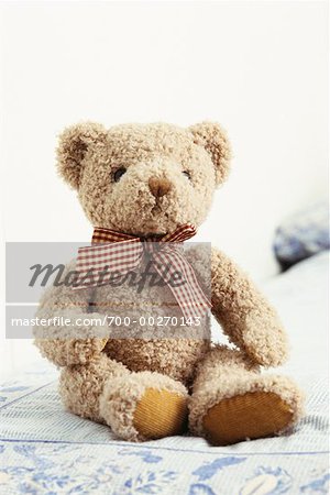 teddy bear on bed