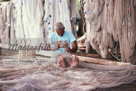 People making fishing net editorial stock image. Image of auction