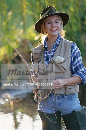 Woman Fishing - Stock Photo - Masterfile - Rights-Managed, Artist: George  Shelley, Code: 700-00285889