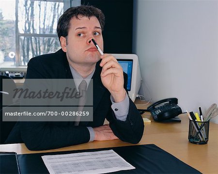 Man Bored at Work - Stock Photo - Masterfile - Rights-Managed, Artist: Noel  Hendrickson, Code: 700-00286259