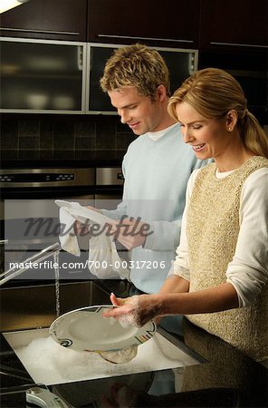 Couple Washing Dishes