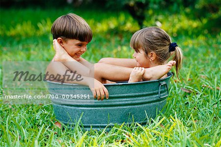 Boy And Girl In Basin Stock Photo Masterfile Rights Managed Artist George Shelley Code 700