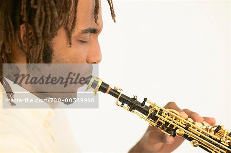 Profile of Man Playing Soprano Saxophone