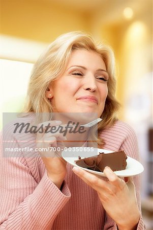 Woman Eating Chocolate Cake