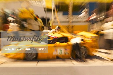 Pit Crew Working on Race Car