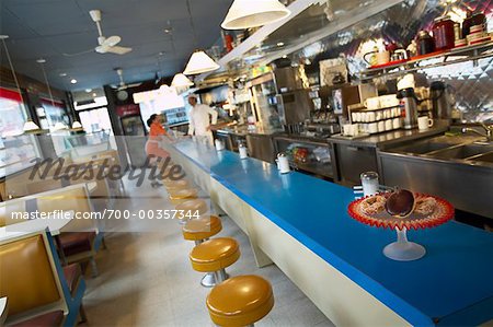 Interior of Diner, Cook and Waitress Standing at Counter