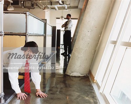 Man Sneaking out of Office - Stock Photo - Masterfile - Rights-Managed,  Artist: Noel Hendrickson, Code: 700-00364002