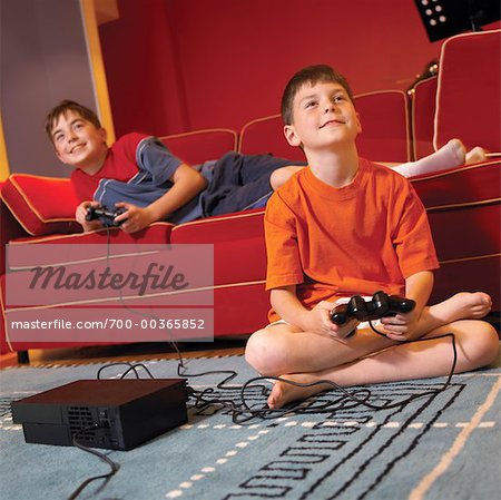 Children playing video game - Stock Photo - Masterfile - Premium