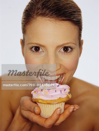 Portrait of Woman Eating Cupcake