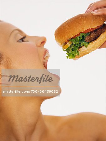 Woman Eating Hamburger