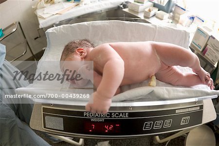 Newborn Baby Being Weighed