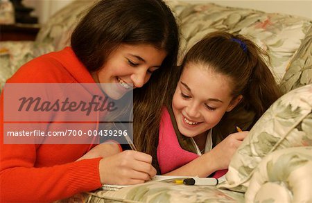 Two Teenage Girls Studying