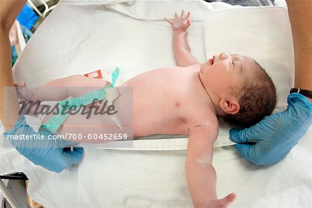 Newborn Being Measured