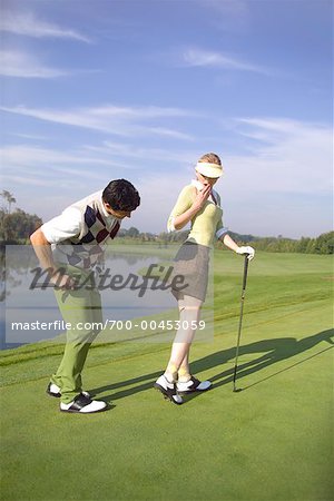 Man Lifting Woman's Skirt at Golf Course