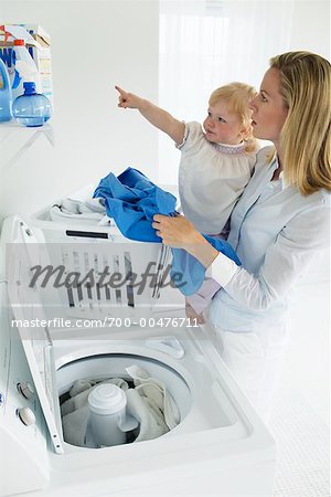 Mother and Daughter Doing Laundry