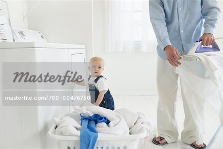 Father and Son in Laundry Room