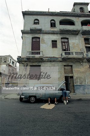 Man Repairing Car on Street, Havana, Cuba