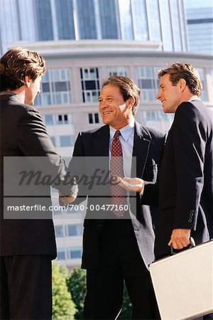 Businessmen Shaking Hands Outdoors