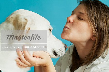 Woman Kissing Dog
