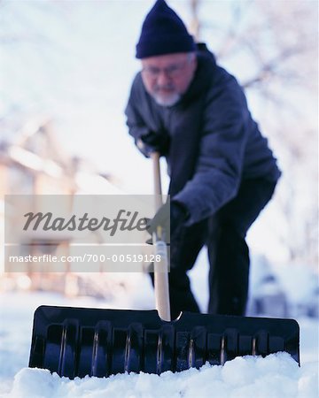 Man Shovelling Snow