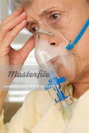 Woman Using Oxygen Mask