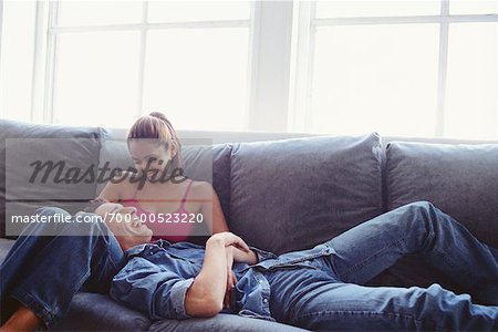 Couple Relaxing on Sofa