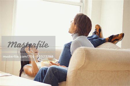 Couple Sitting on Sofa