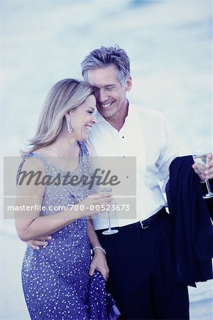 Couple in Formal Wear Drinking Champagne