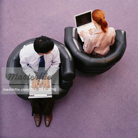 Man Looking at Woman's Computer