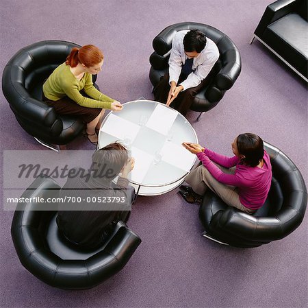 Business People Sitting Around Table